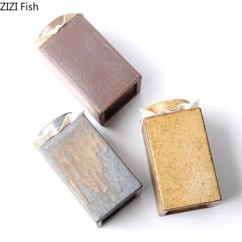 Rustic earth toned ceramic tea canister set with three rectangular tea canister pottery in brown grayish brown and tan hues