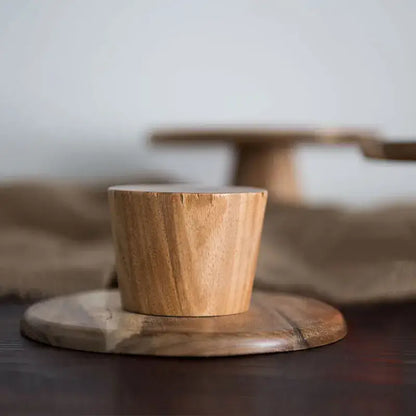 Rustic decorbites elevated wooden cake stand set featuring a natural wood cylindrical coaster on a matching base