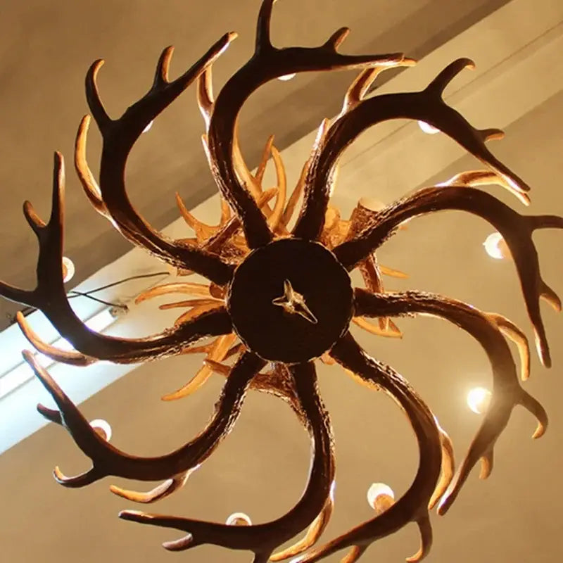 Rustic golden brown antler pendant chandelier with dark rustic finish and golden accents by decorbites antler pendant