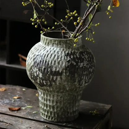 Rustic gray and white coarse pottery vase with mottled finish holding delicate branches for home decorbites coarse pottery decor