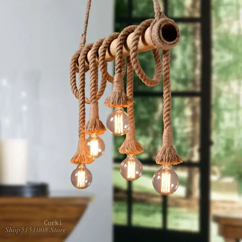 Rustic industrial bamboo pendant lights with rope wrapping and multiple exposed filament bulbs for kitchen decorbites pendant lights