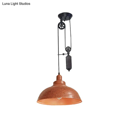 Rust-colored metal rustic industrial dome pendant lamp with black pulley for living room lighting by decorbites