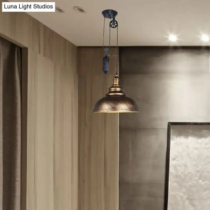 Rustic industrial dome pendant lamp with brass pulley mechanism and dark metal accents for living room lighting
