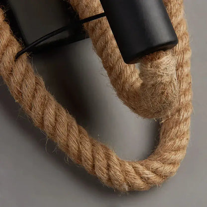 Rustic industrial hemp rope wall lamp with thick natural beige hemp rope threaded through black fixtures