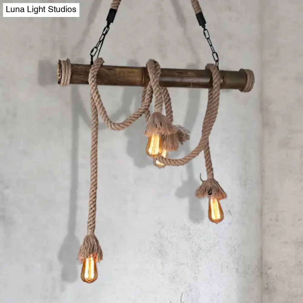 Rustic beige rope-wrapped bamboo island pendant light with three exposed filament bulbs for dining room hanging lamp