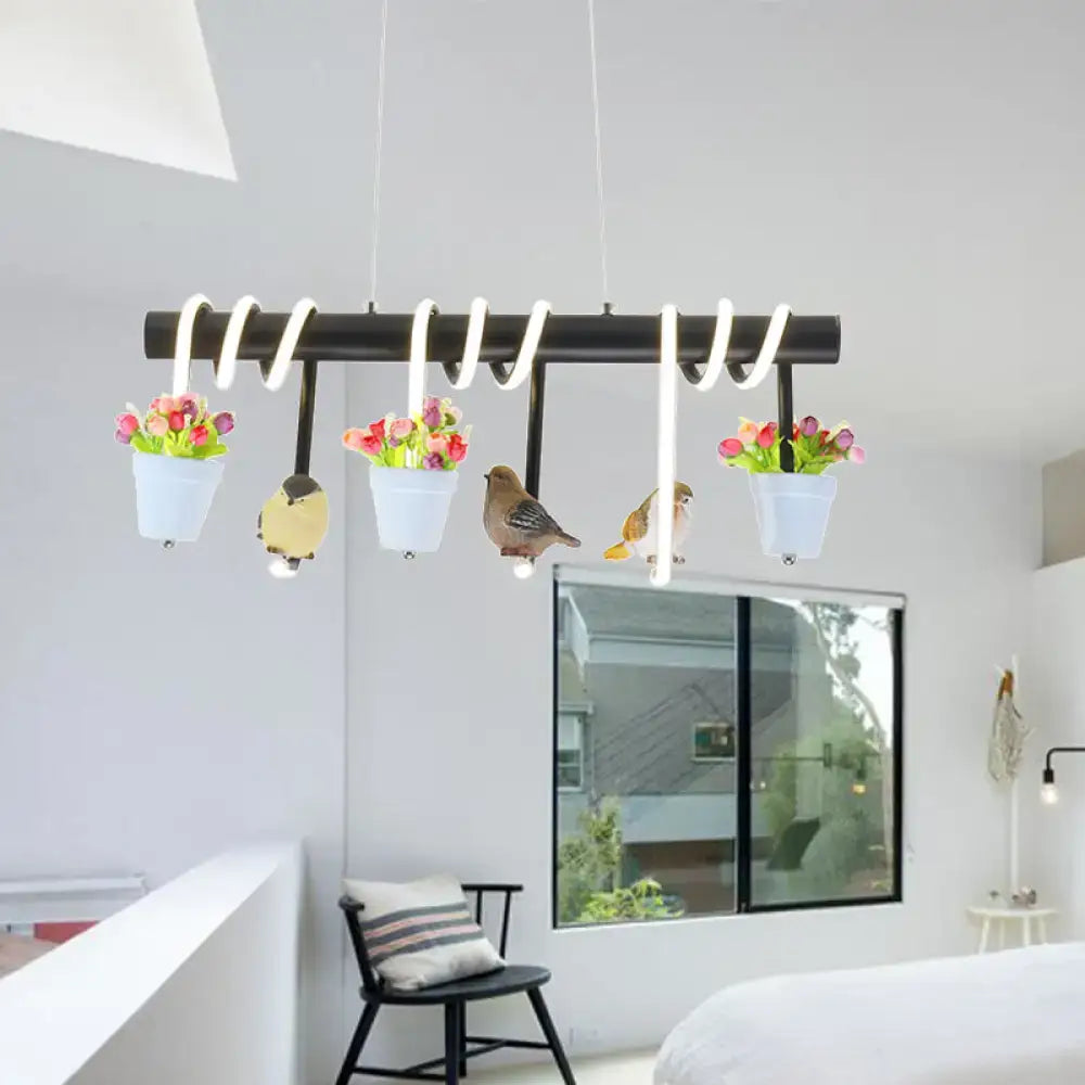 Black spiral pendant light with white hanging planters and bird figurines for rustic led island decor by DecorBites™