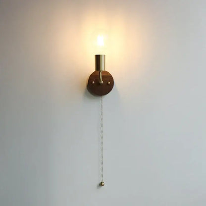 Minimalist rustic led walnut wood wall sconce with brass lamp head, dark wood base, and elegant pull chain for bedroom decorbites led walnut