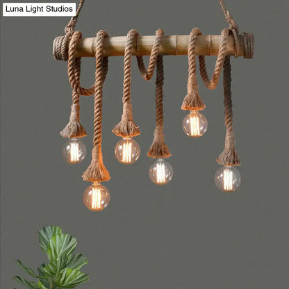 Rustic bamboo island light with beige rope and five clear glass bulbs in decorbites lodge industrial style