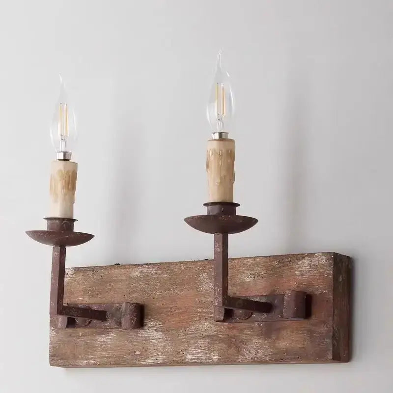 Rustic solid wood wall light with wrought iron candle holders and vintage filament bulbs for retro bedroom decorbites country retro