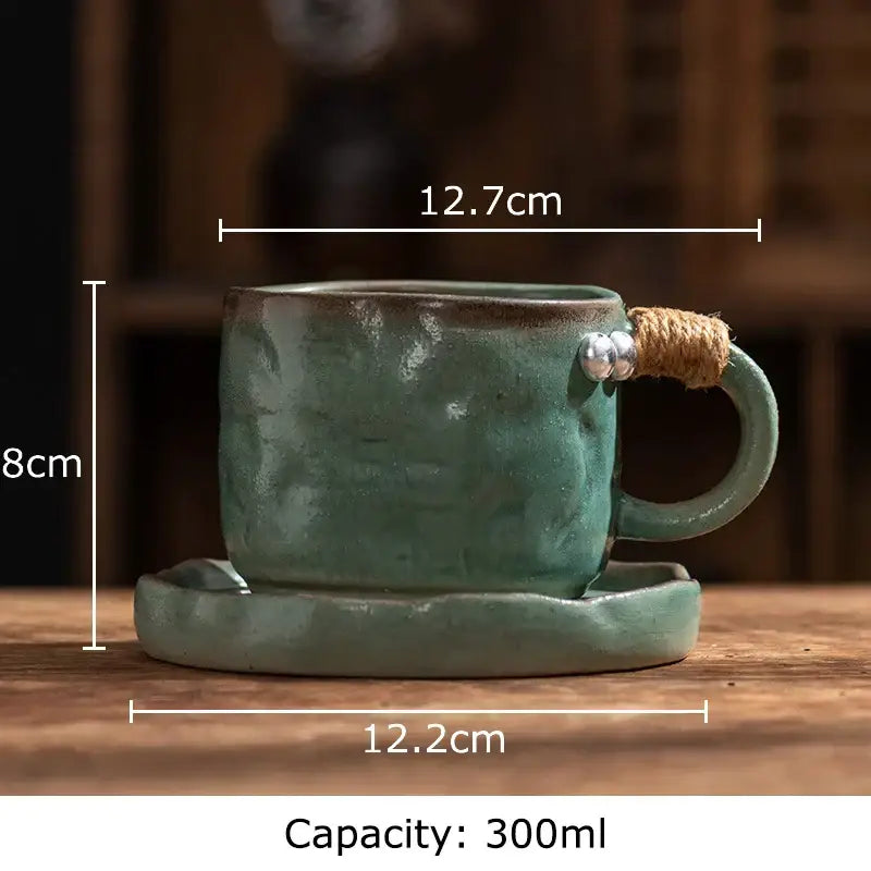 Rustic teal coarse pottery cup with textured finish and twine-wrapped handle adorned with silver beads by decorbites coarse pottery