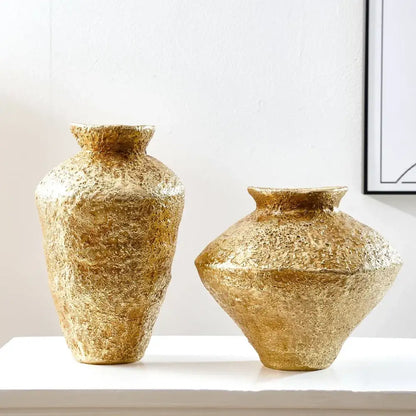 Two textured gold-colored ceramic vases with a rustic handcrafted finish ideal for decorbites golden vase resin handicraft decor
