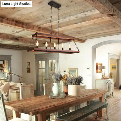 Rustic vintage brown wood chandelier with five exposed bulbs suspended by dark metal chains for dining room island light