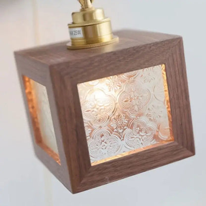 Rustic walnut and brass led wall lamp with warm wooden cube and frosted floral glass panels for dining room sconce