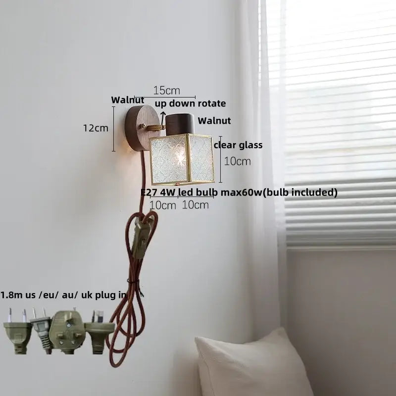 Rustic walnut wood wall sconce with clear glass cube shade and brass accents for bedroom lighting fixture