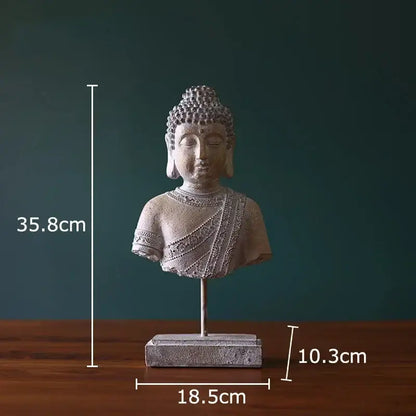 Rustic weathered bronze buddha head statue with intricate gray stone detailing on rectangular base for living room decor