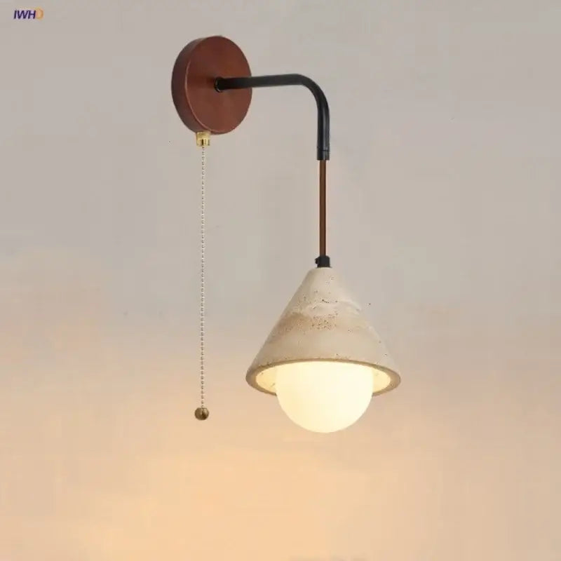 Rustic white concrete and wood wall light fixture with matte white conical shade and black metal arm for bedroom