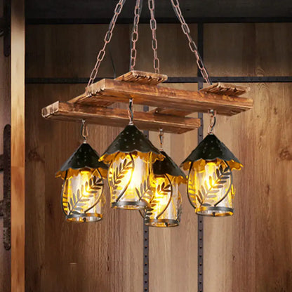Rustic wooden chandelier with three clear glass lanterns, white fabric shades, metal arm, and warm yellow lighting