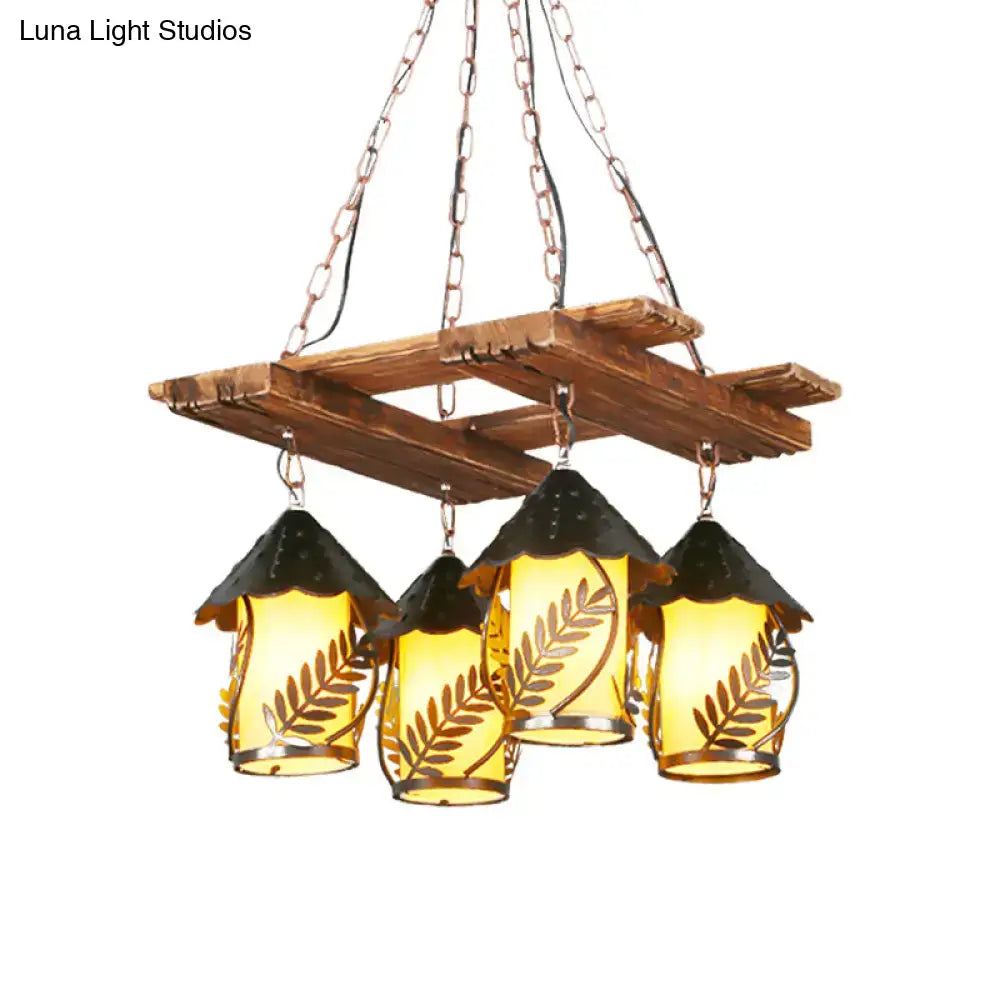 Rustic wooden chandelier with four amber glass lanterns leaf cutouts black metal roofs and metal arm decorbites industrial pendant