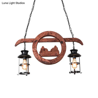 Rustic brown wooden lantern pendant lamp with black metal lanterns and carved mountain silhouette by DecorBites
