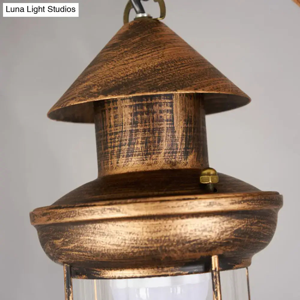 Rustic brown wooden lantern with brass accent and glass panel in decorbites™ bronze coastal 4-light island light fixture