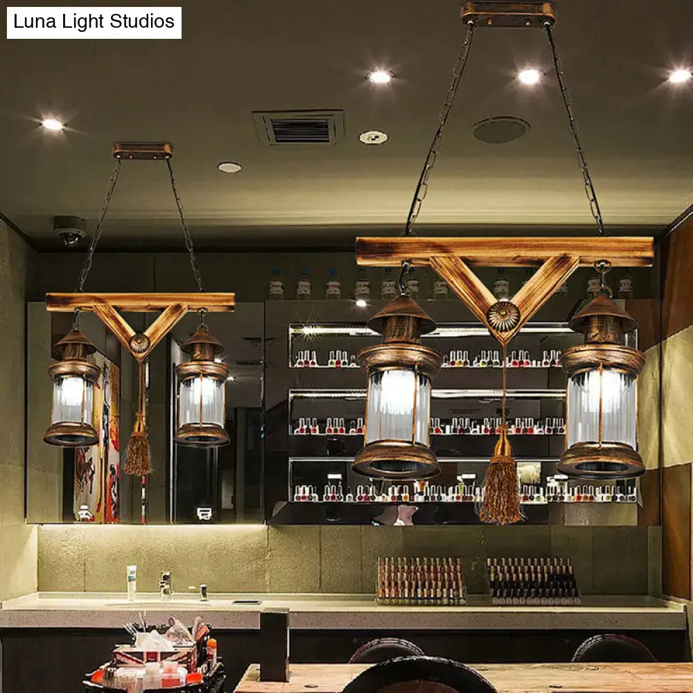 Rustic wooden decorbites bronze coastal glass 4-light island light fixture with brass lanterns and tassels
