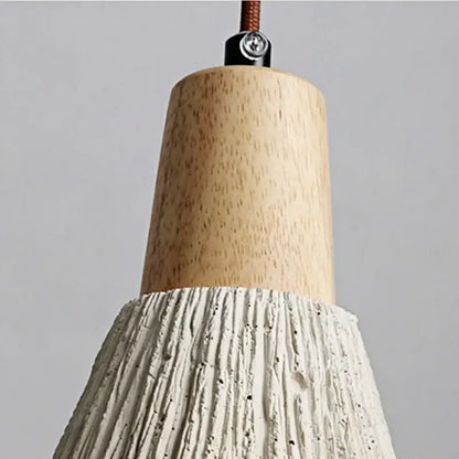 Rustic wall light fixture with natural wood top and textured white concrete shade for bedroom use with pull chain