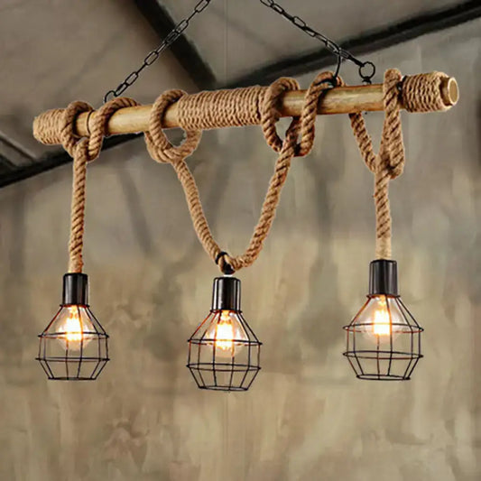 Rustic industrial island light with wooden beam wrapped in rope and three black caged edison bulbs for dining room