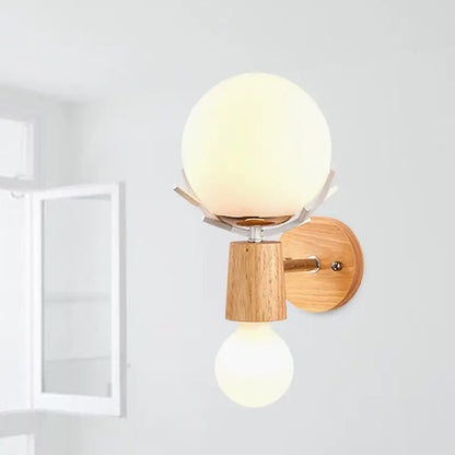 Modern wall lamp with white globe sconce featuring frosted glass globe, wooden base, and metallic accents for stairways