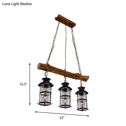 Rustic wooden beam chandelier with three black lantern-style lights featuring wood design and clear glass elements