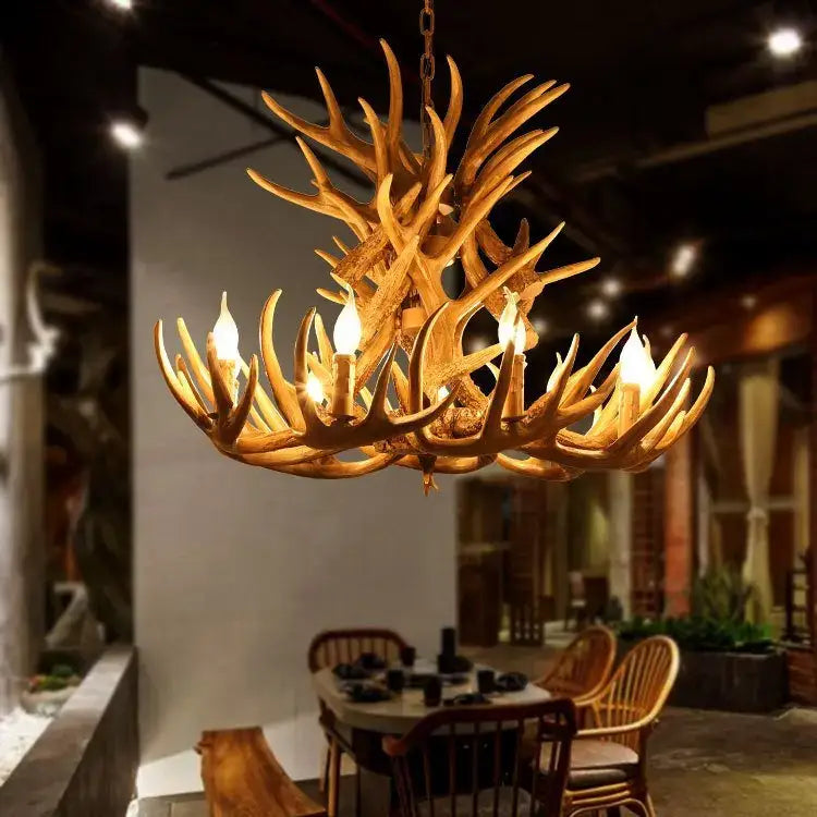 Rustic wood finish decorbites deer antler chandelier in warm golden tone with multiple candle style bulbs for dining room light