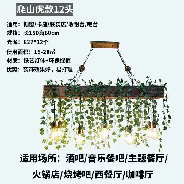 Rustic wood hanging chandeliers with exposed edison bulbs and green ivy for dining room or bar hanging lighting