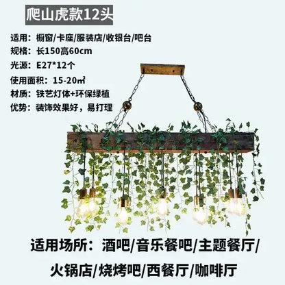 Rustic wood hanging chandeliers with exposed edison bulbs and green ivy for dining room or bar hanging lighting