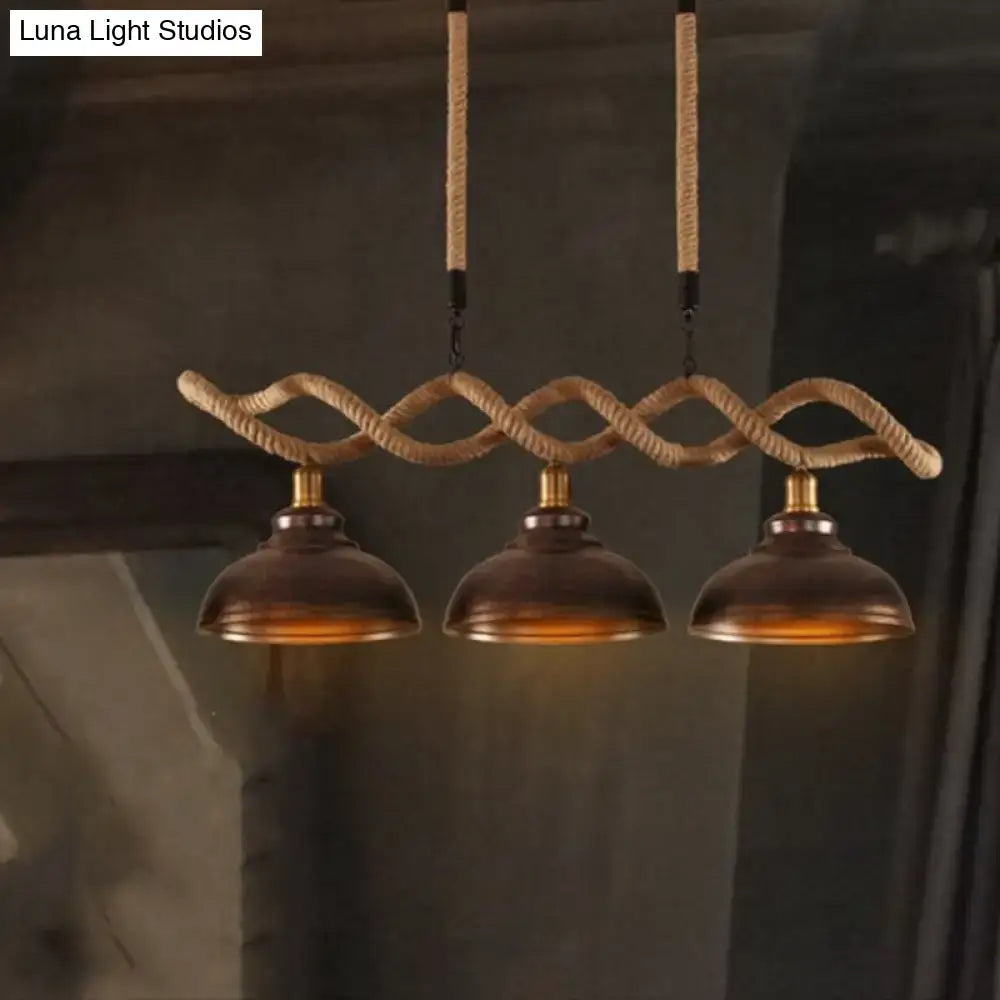 Three-bulb industrial pendant light with braided beige rope and bronze metal shades for kitchen island lighting