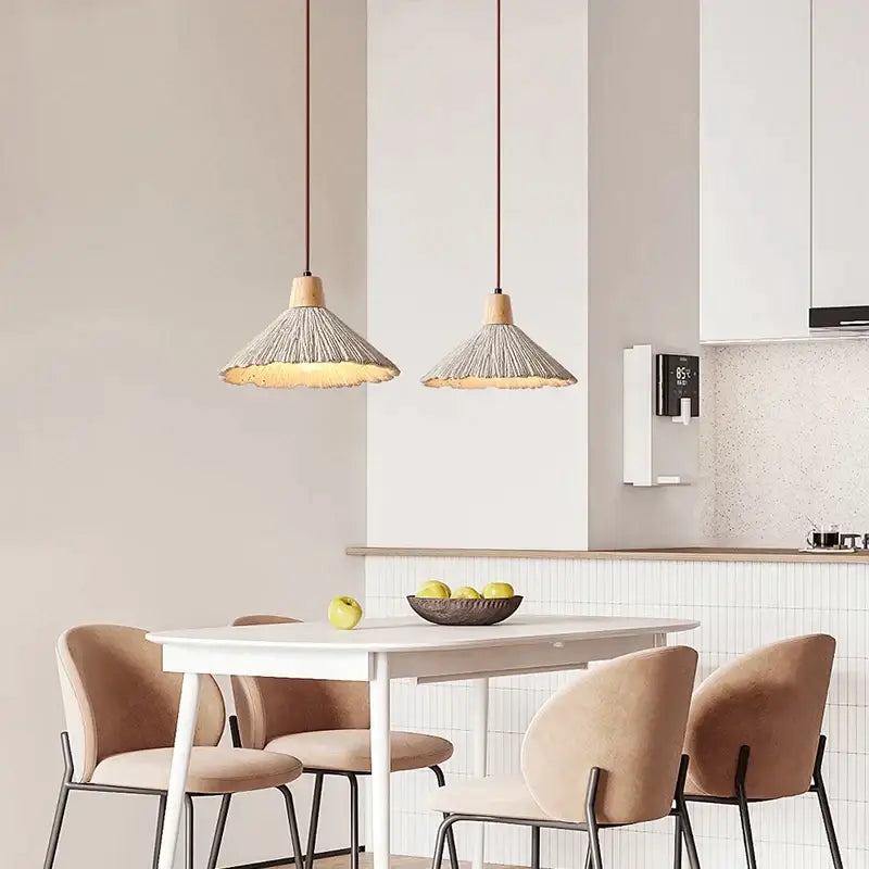 Two beige woven pendant lamps with wooden tops and dark cords from the decorbites designer pendant lamps collection