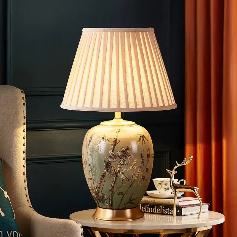 Sage green american style ceramic table lamp with gold leaf bird bamboo design and off white pleated shade decorbites american style