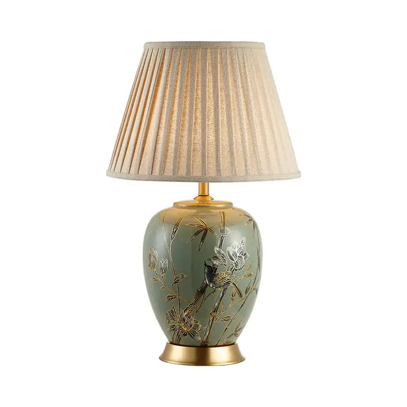 Sage green american style ceramic table lamp with gold-leafed bamboo and bird decorbites american style motifs and beige shade