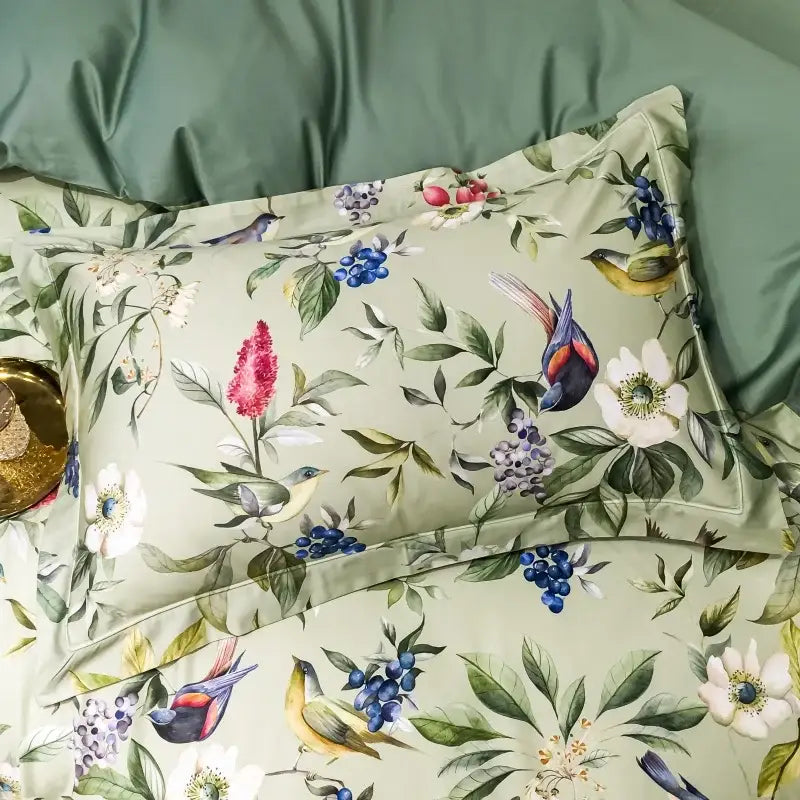 A soft sage green pillow sham with vibrant bird floral print from decorbites 1400tc egyptian cotton bedding set