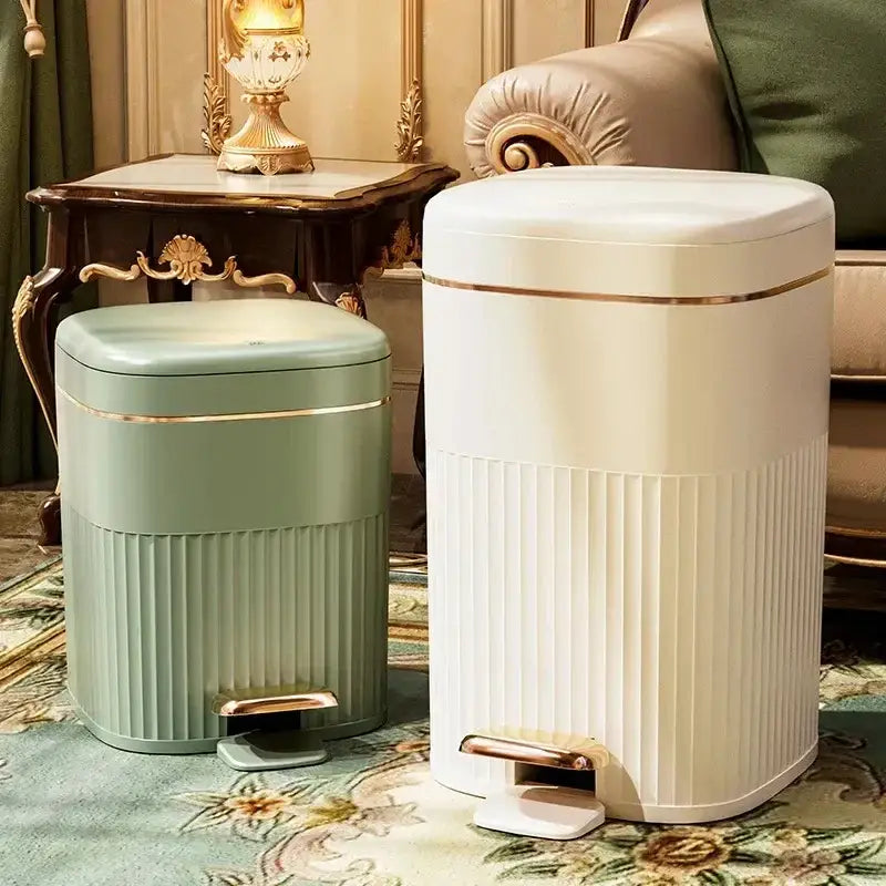Two elegant sage green and cream ribbed pedal trash cans with gold-tone accents from decorbites light luxury pedal series
