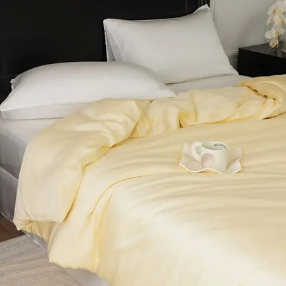 Soft pale yellow quilted comforter with subtle stitching in sage green double layer satin queen duvet set bedroom bedding