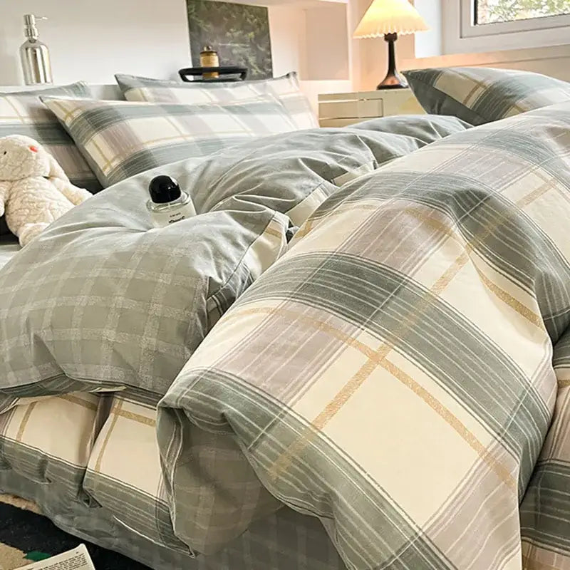 Sage green grid print cotton bedding set with plaid design in cream and muted gold tones by decorbites grid print