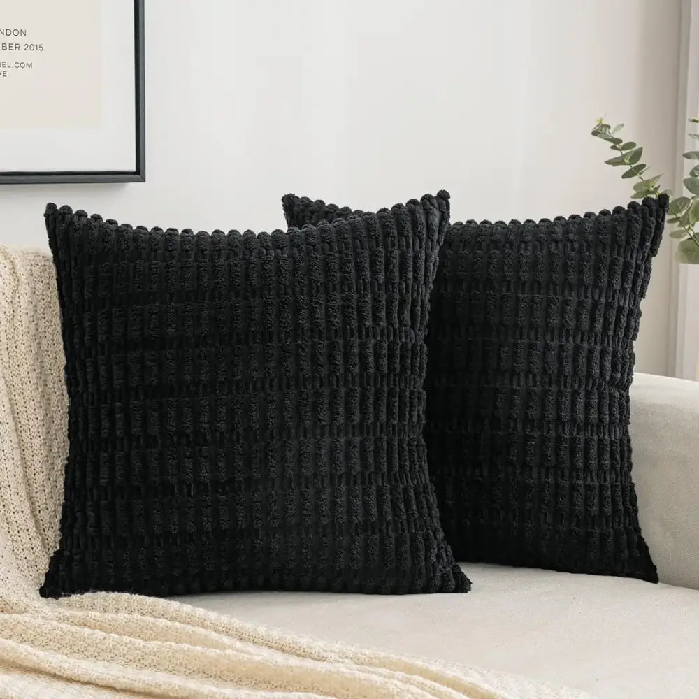 Black ribbed corduroy throw pillow cover with textured fabric and piped edges for stylish living room decor