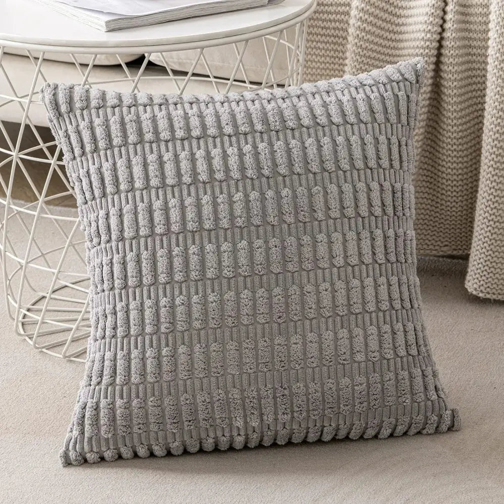 Gray textured throw pillow with a raised woven pattern and ribbed corduroy pillow cover for living room decor