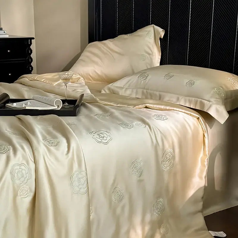 Cream-colored satin quilt set with delicate silver eucalyptus fiber flower embroidery for bedroom decorbites collection
