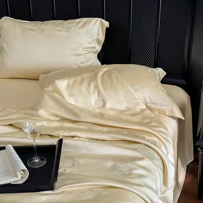 Cream satin quilt set with delicate eucalyptus fiber flower embroidery for elegant bedroom decorbites bedding