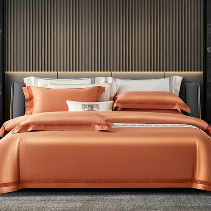 Orchid-colored satin duvet cover set with embroidered detailing and subtle striped border in cream and gold egyptian cotton