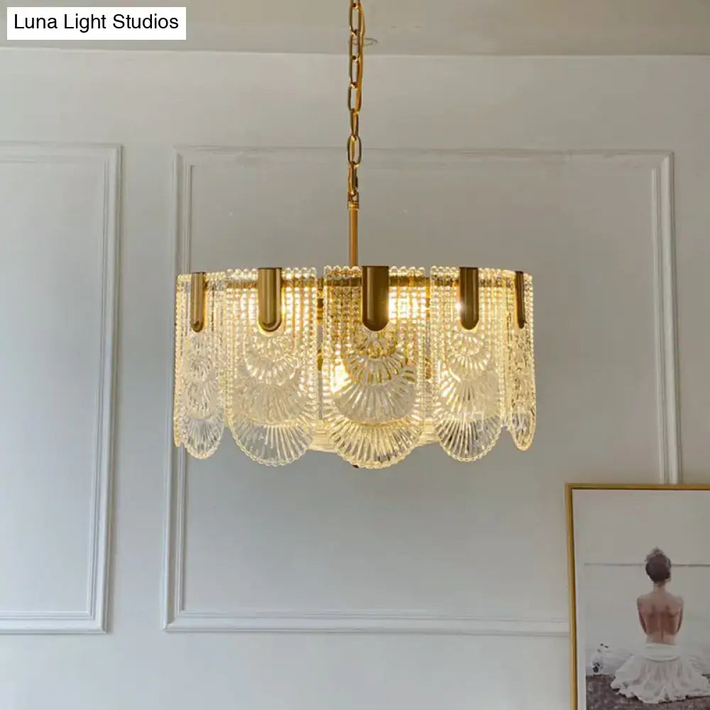 Gold-toned DecorBites scalloped clear textured glass drop chandelier with intricate fan-shaped panels for dining room lighting