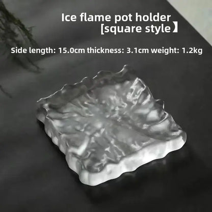 Clear square-shaped scalloped crystal glass coaster with textured frosty surface used as minimalist jewelry display panel