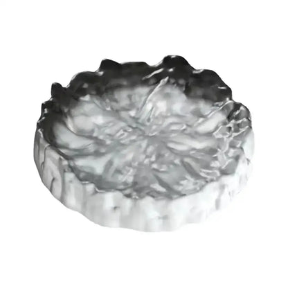 Silver metallic ashtray with textured leaf design and scalloped edges for crystal glass coaster and jewelry display panel