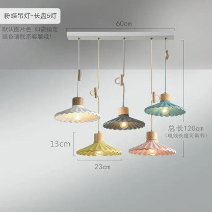 Scalloped pastel led pendant lights shaped like butterflies with wooden accents and adjustable cords for dining room