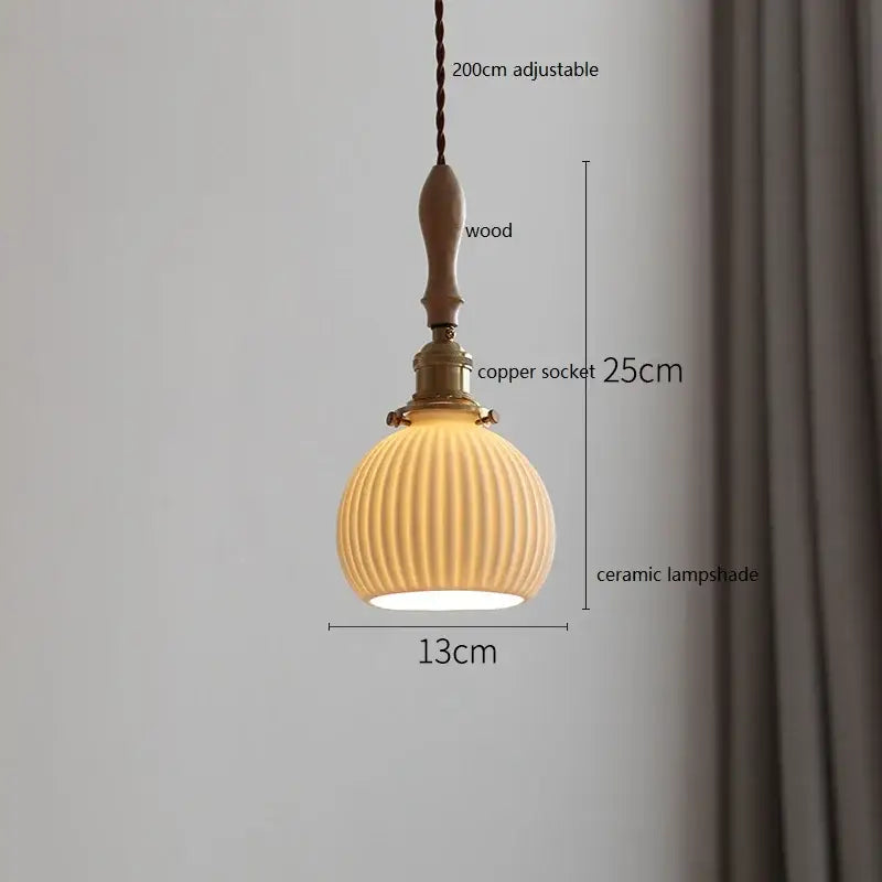 Scalloped white ceramic led pendant light with vertical ridges suspended by wooden handle and copper socket decorbites ceramic led